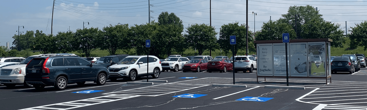 parking lot with cars and bus stop shelter